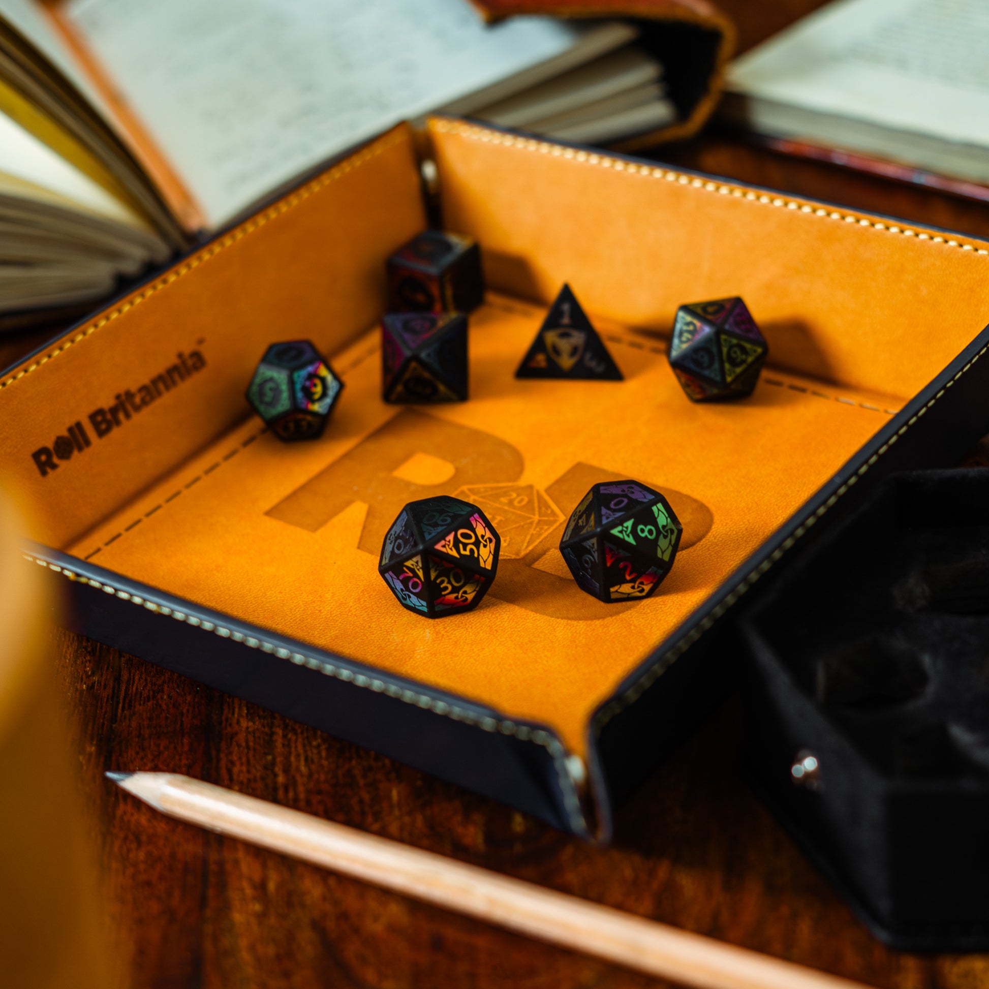 Roll Britannia Sharp Edged Obsidian Gemstone Dungeons and Dragons Dice Set with Iridescent details in branded leather dice tray