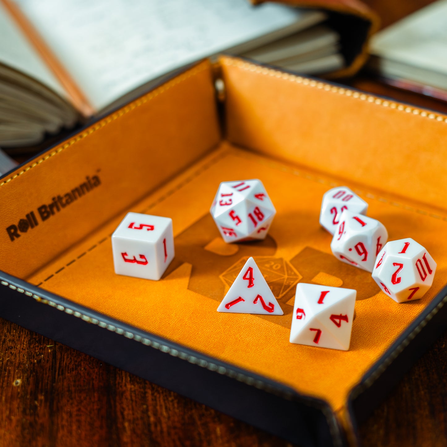 Roll Britannia Royal Guard Sharp Edged Electroplating Dungeons and Dragons Dice Set with Red and White Aesthetic on branded dice tray