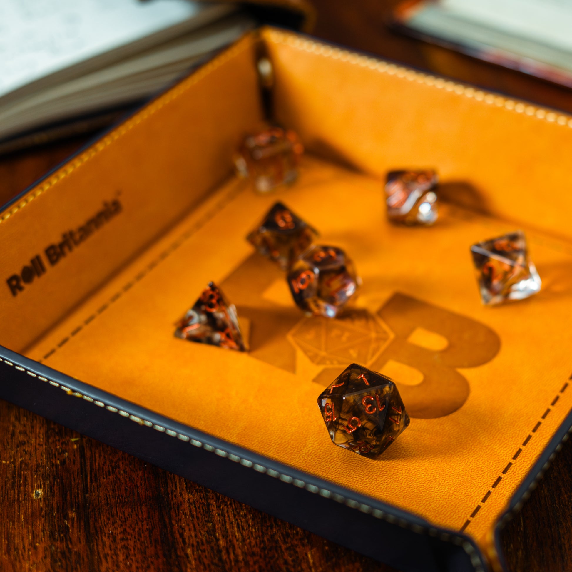 Roll Britannia Jeff Silverbow Dungeons and Dragons Dice Set with Smoke and Fire Aesthetic in branded dice tray